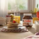Nutella - Crema Spalmabile alle Nocciole e Cacao, Senza Glutine, Conservanti e Grassi Idrogenati, Ideale a Colazione, Vasetto da 600 gr - 2